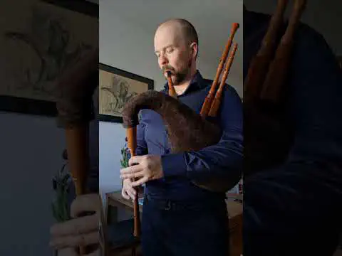 Michael Vereno playing bagpipes in the video's official thumbnail.