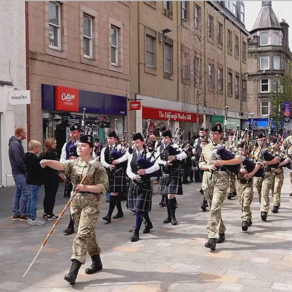 Pipe Bands lead the 2025 City of Perth Salute Military parade along Perth High Street in Scotland