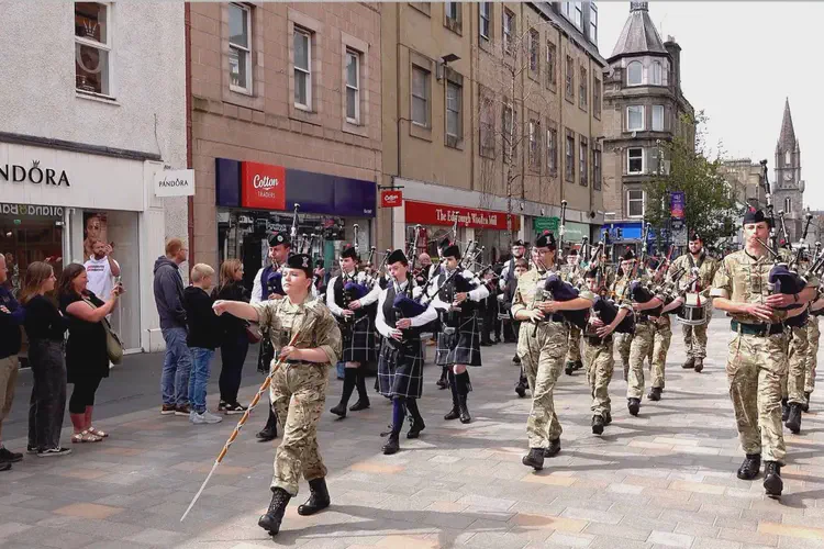 Pipe Bands lead the 2025 City of Perth Salute Military parade along Perth High Street in Scotland