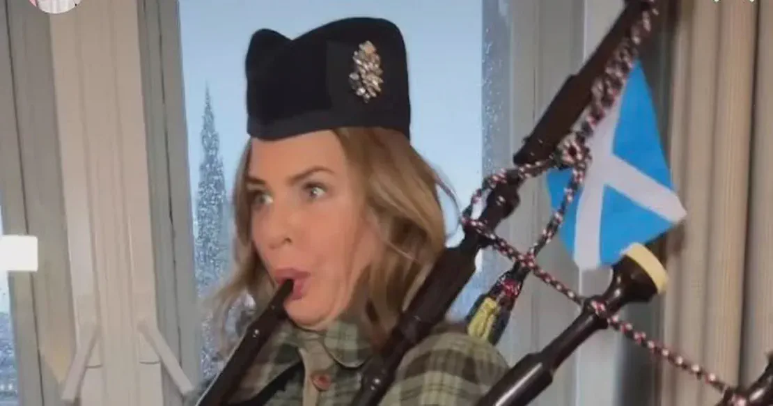 Fashion guru Trinny Woodall tries out the bagpipes during a visit to Scotland - Daily Record